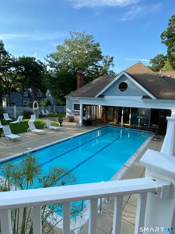 a view of swimming pool with sitting area