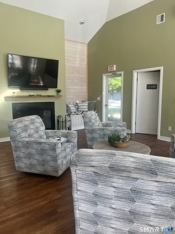 a view of house with yard and seating space