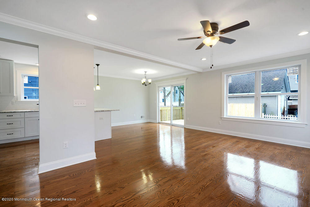 154 Pinehurst Road Brick, NJ 08723 - Photo 11 of 36 a view of an empty room with window and wooden floor