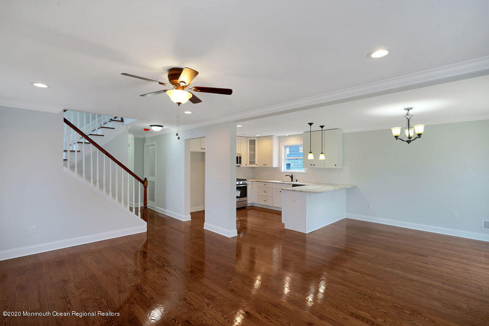154 Pinehurst Road Brick, NJ 08723 - Photo 12 of 36 a view of kitchen and living room with wooden floor
