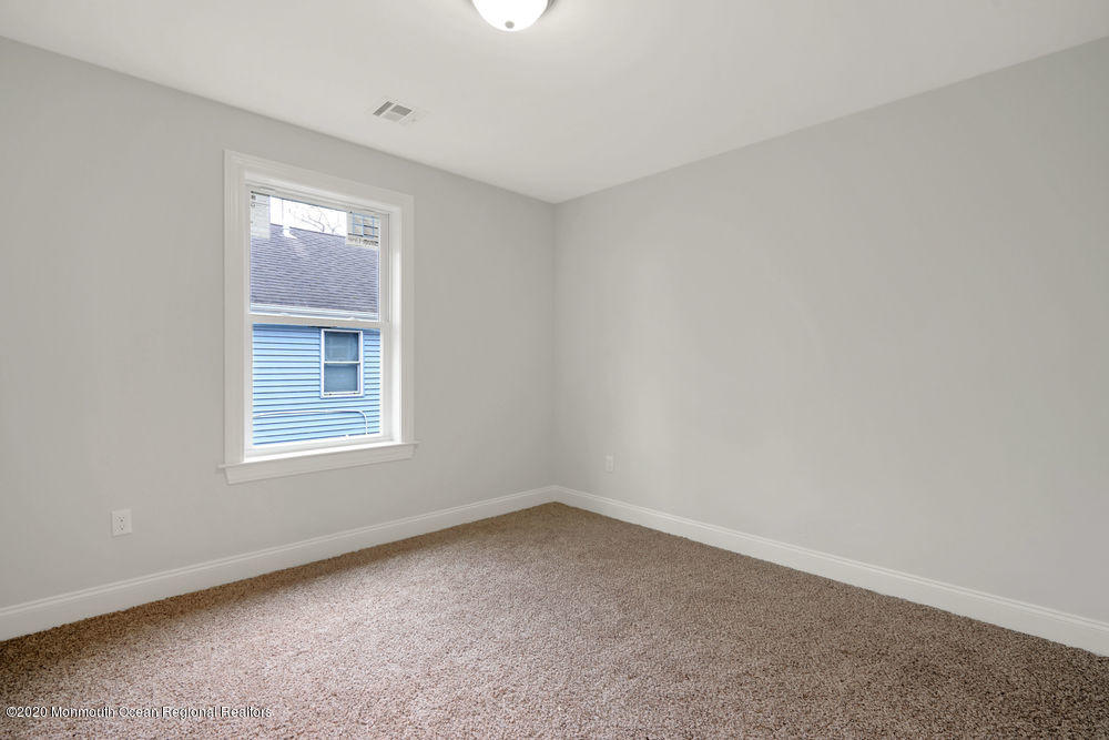 154 Pinehurst Road Brick, NJ 08723 - Photo 24 of 36 an empty room with a window