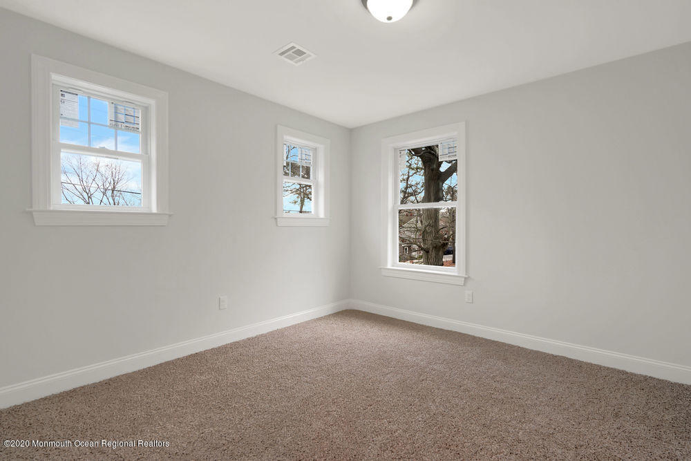 154 Pinehurst Road Brick, NJ 08723 - Photo 26 of 36 an empty room with windows