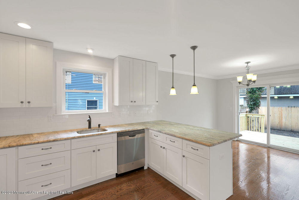 154 Pinehurst Road Brick, NJ 08723 - Photo 5 of 36 a kitchen with sink cabinets and window
