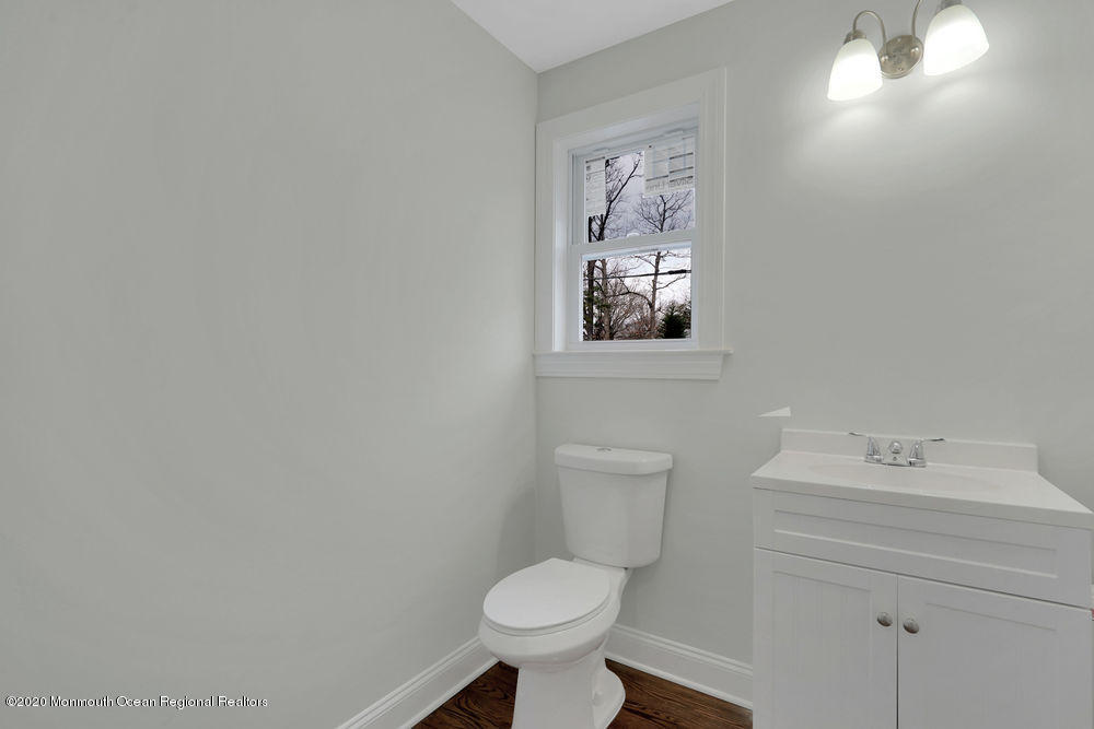 154 Pinehurst Road Brick, NJ 08723 - Photo 10 of 36 a bathroom with a toilet sink and mirror
