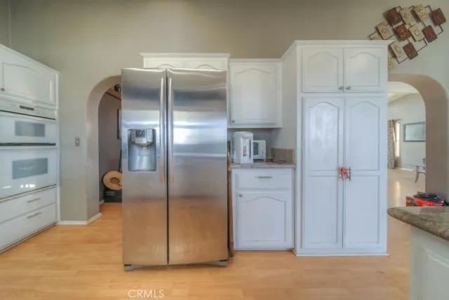 a bedroom with a bed and chair