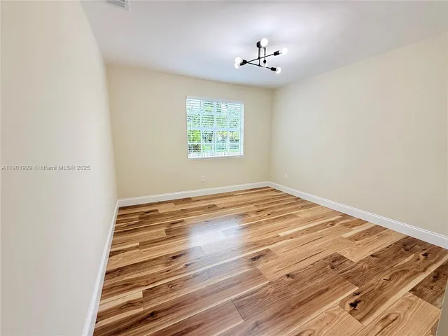a bathroom with a sink mirror and toilet