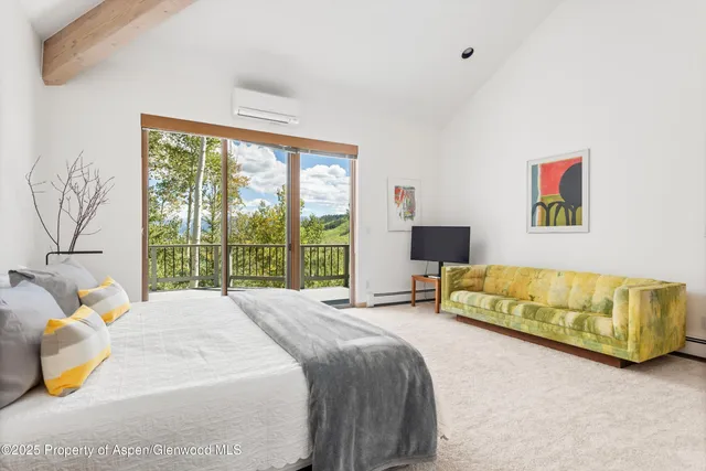 a view of a balcony with furniture