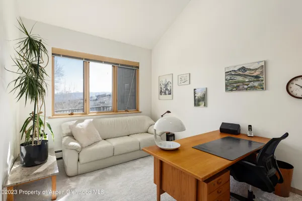 a en suite bathroom with a granite countertop sink and a mirror