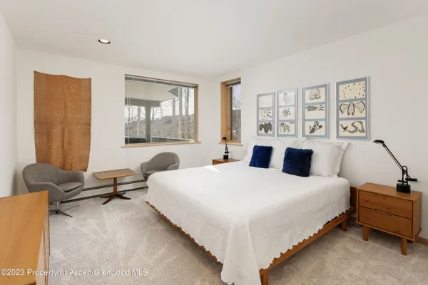 a view of a chairs and table in patio