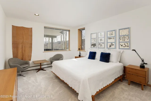 a view of a chairs and table in patio