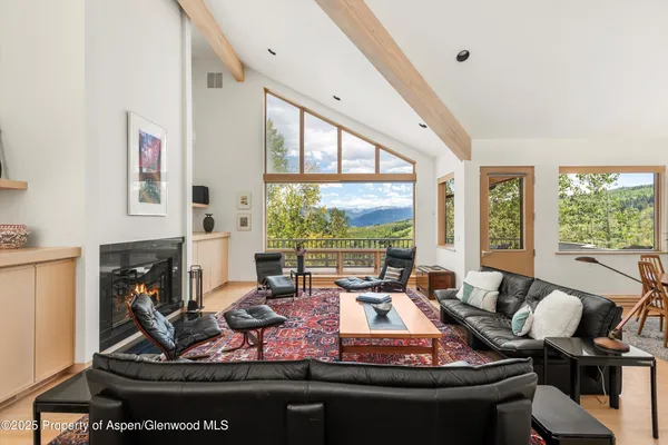 a room with furniture and a large window