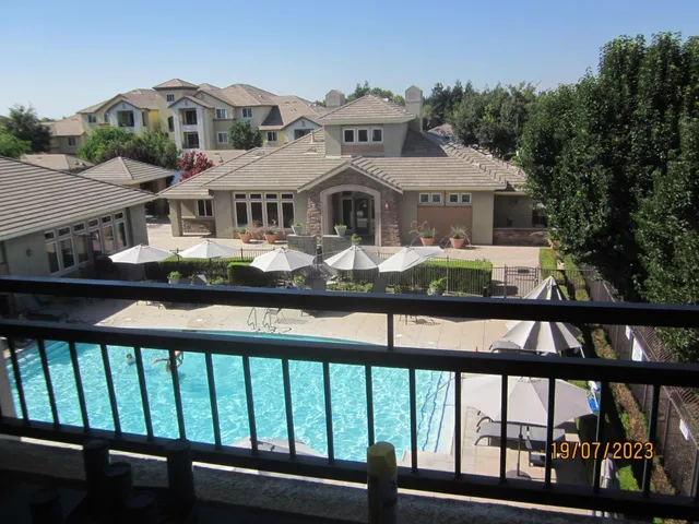 a front view of a house with yard and porch