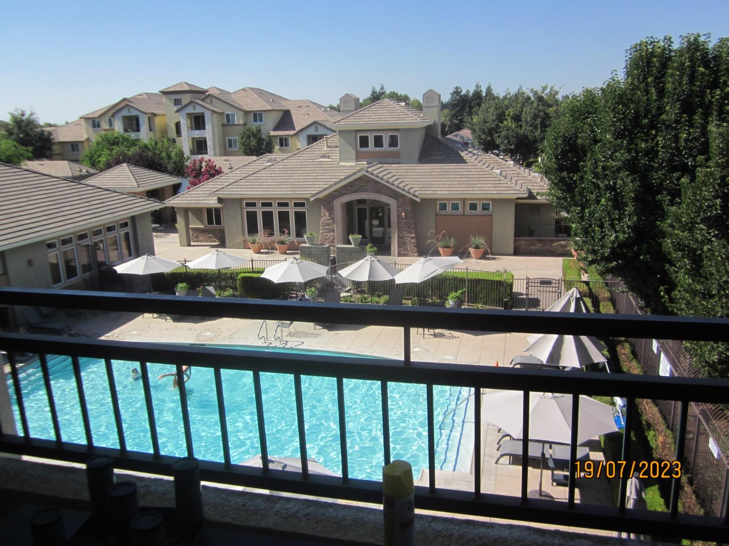 1360 Shady Lane, Unit 733 Turlock, CA 95382 - Photo 11 of 20 a front view of a house with yard and porch