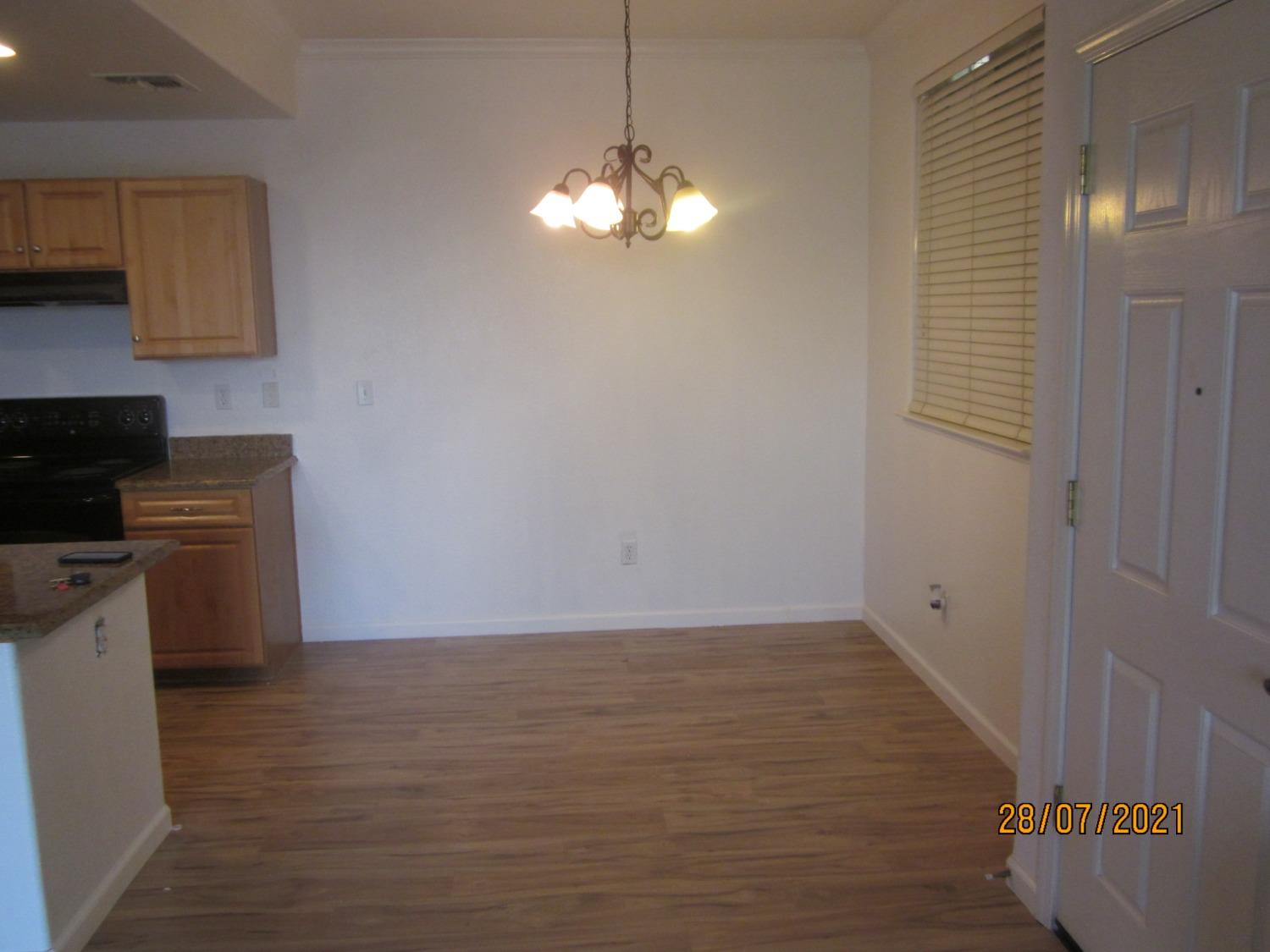 1360 Shady Lane, Unit 733 Turlock, CA 95382 - Photo 13 of 20 a view of kitchen and chandelier