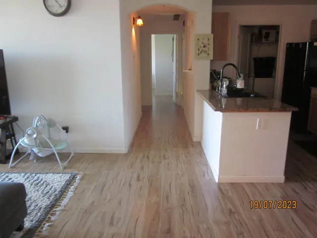 a view of a kitchen from the hallway