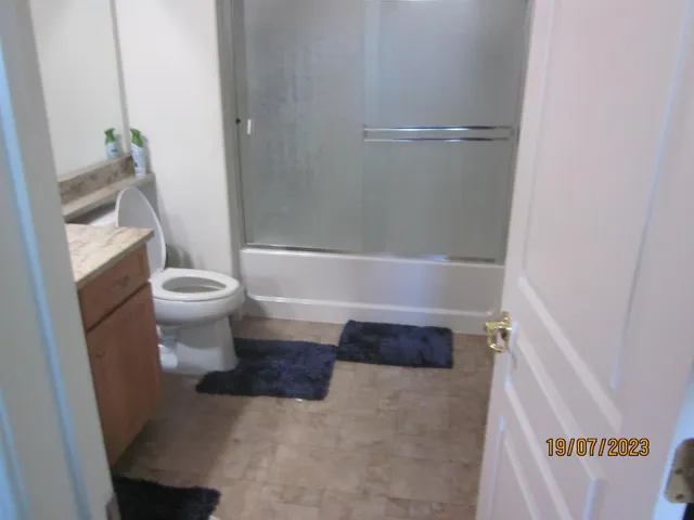 a bathroom with a toilet and a bathtub