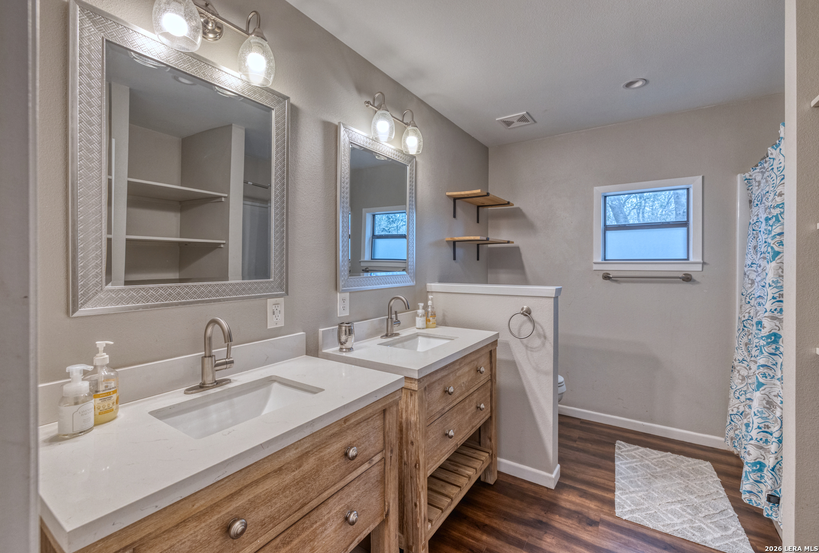 1674 Flat Rock Road Rio Frio, TX 78879 - Photo 22 of 39 a bathroom with a double vanity sink and a mirror