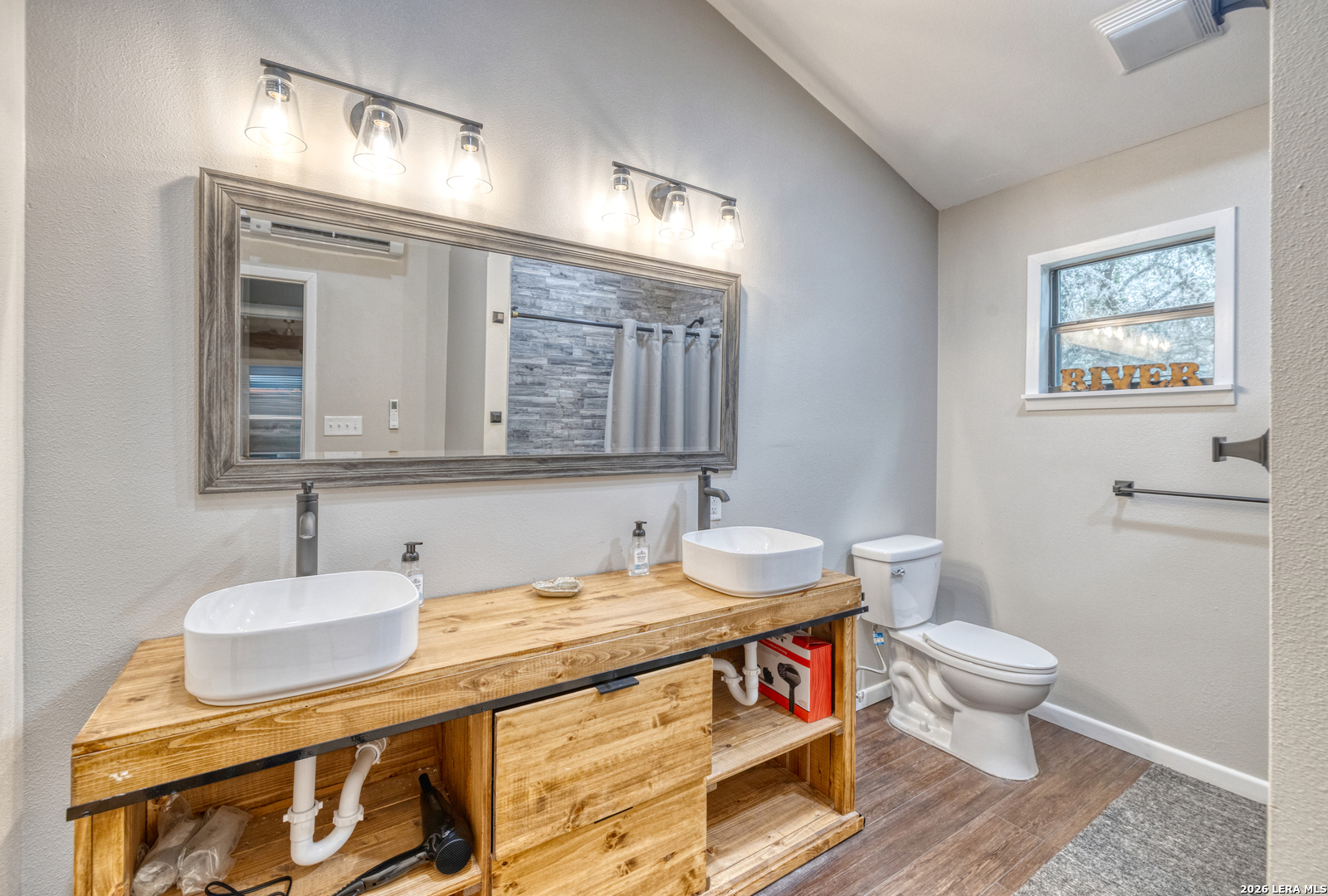 1674 Flat Rock Road Rio Frio, TX 78879 - Photo 25 of 39 a bathroom with a sink and a mirror