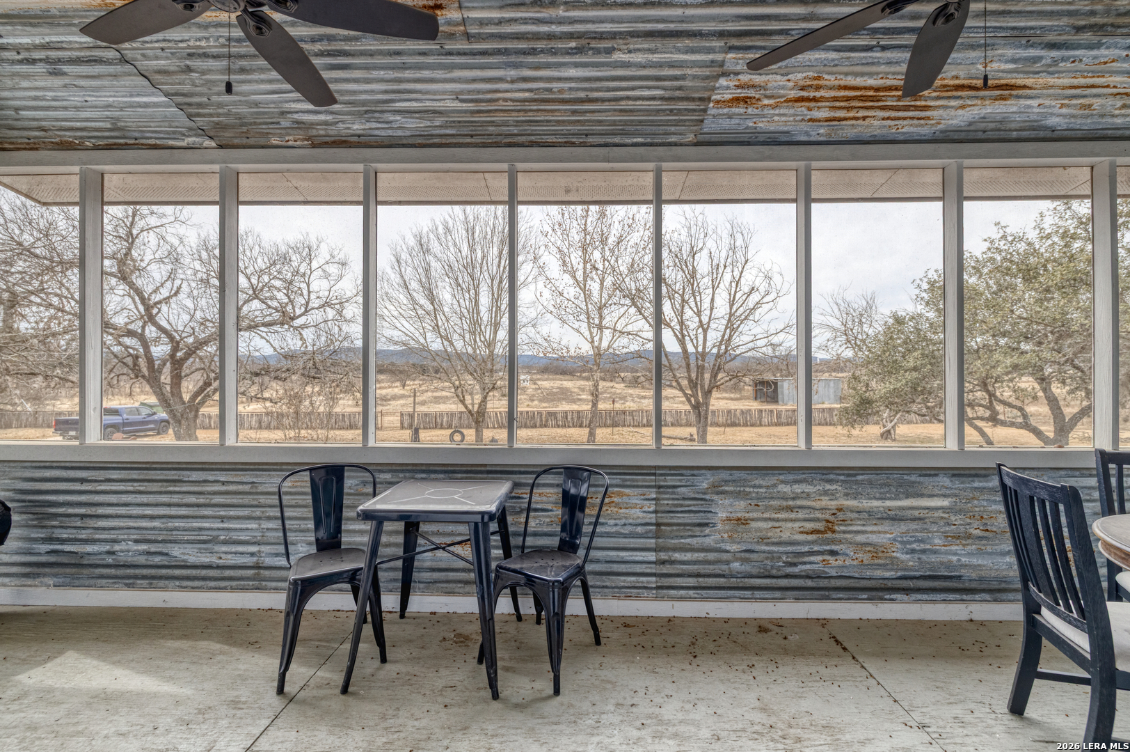 1674 Flat Rock Road Rio Frio, TX 78879 - Photo 32 of 39 a table with chairs and a wooden roof