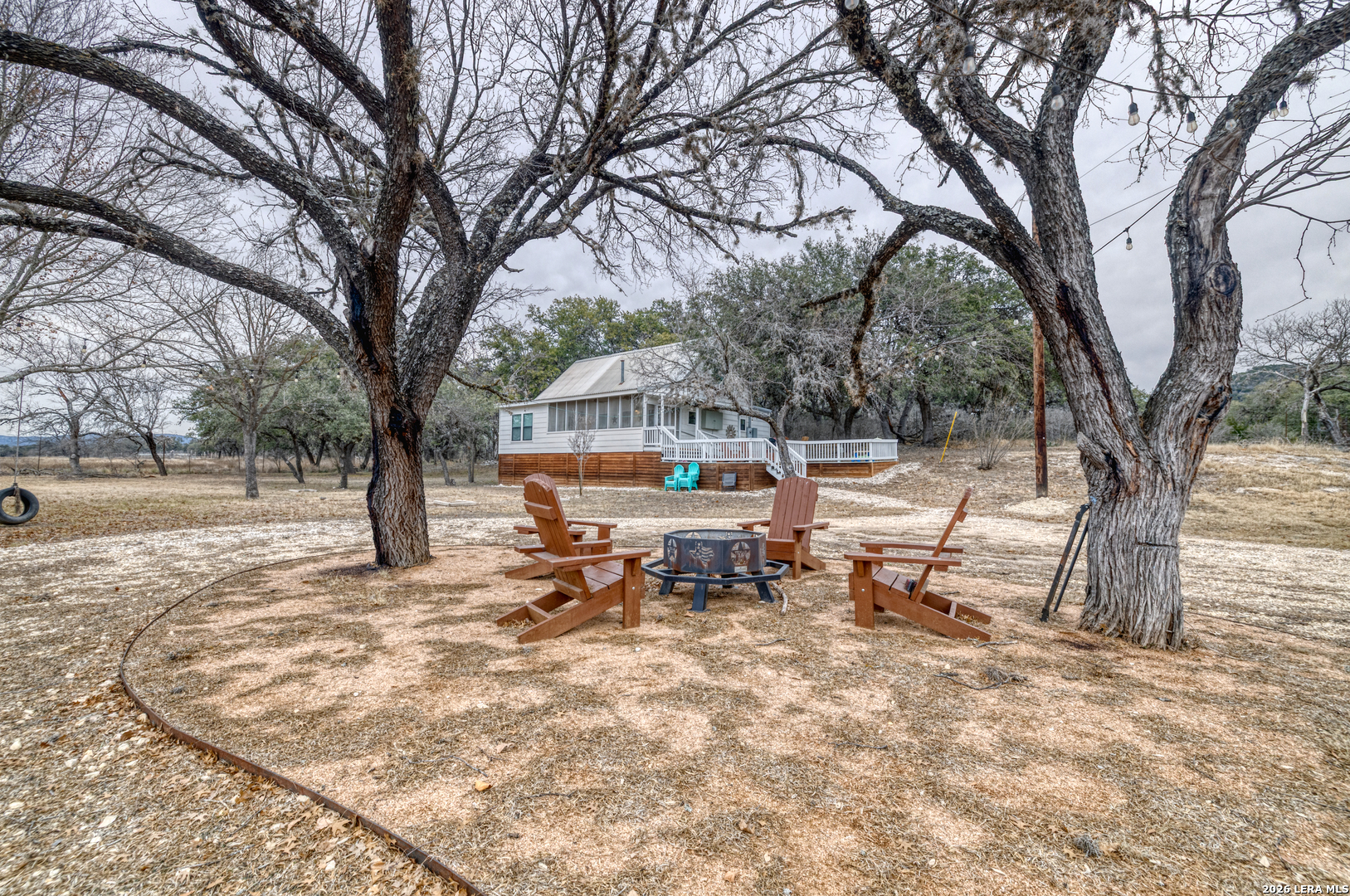 1674 Flat Rock Road Rio Frio, TX 78879 - Photo 4 of 39 a view of a house with a yard covered in snow