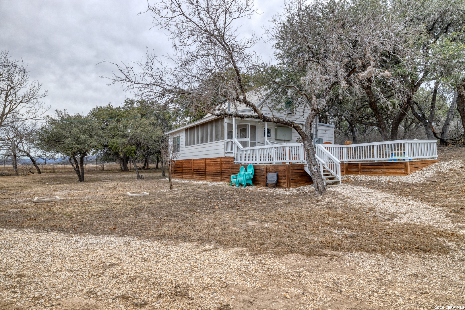 1674 Flat Rock Road Rio Frio, TX 78879 - Photo 6 of 39 a front view of house with trees and trees around