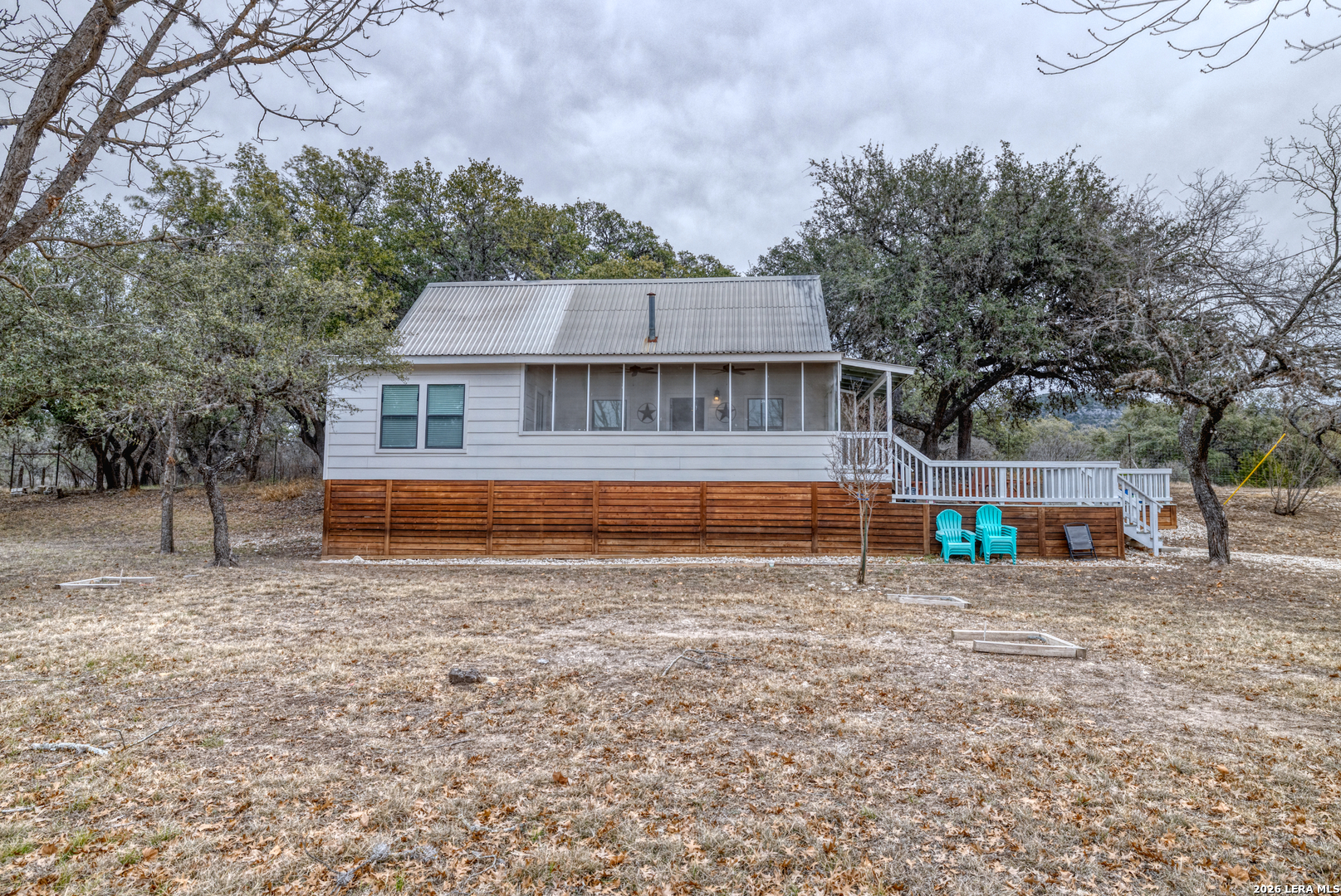 1674 Flat Rock Road Rio Frio, TX 78879 - Photo 7 of 39 a view of a house with a yard