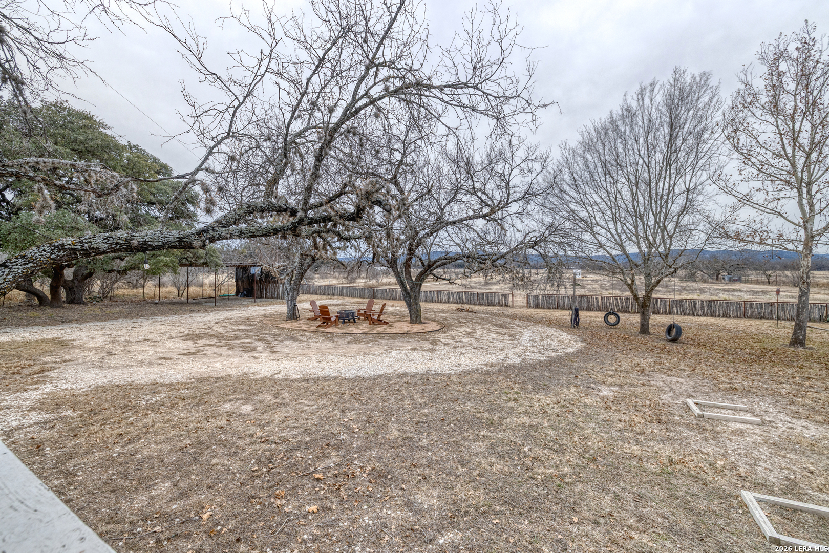 1674 Flat Rock Road Rio Frio, TX 78879 - Photo 9 of 39 a view of a yard with a tree