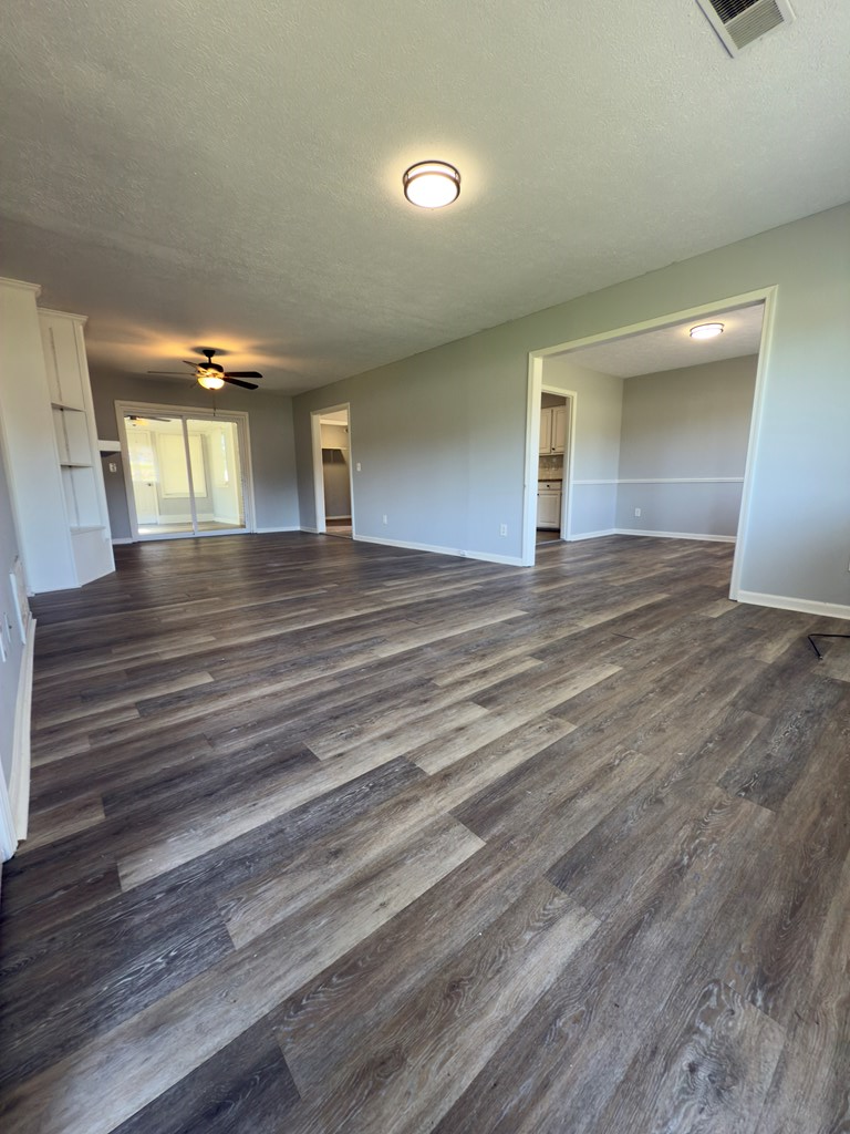 5829 Moon Road Columbus, GA 31909 - Photo 2 of 20 a view of an empty room and wooden floor