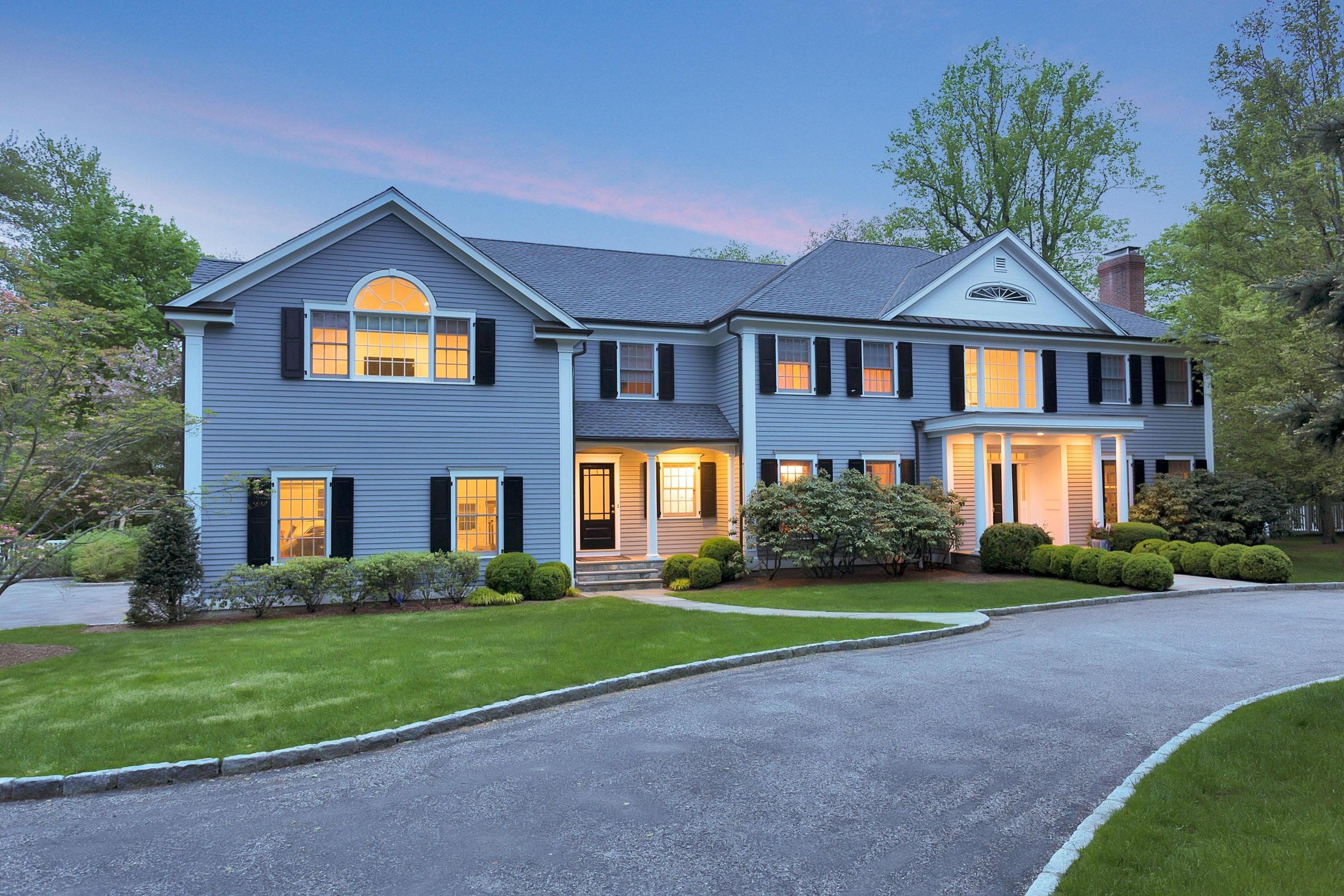 a front view of a house with a yard