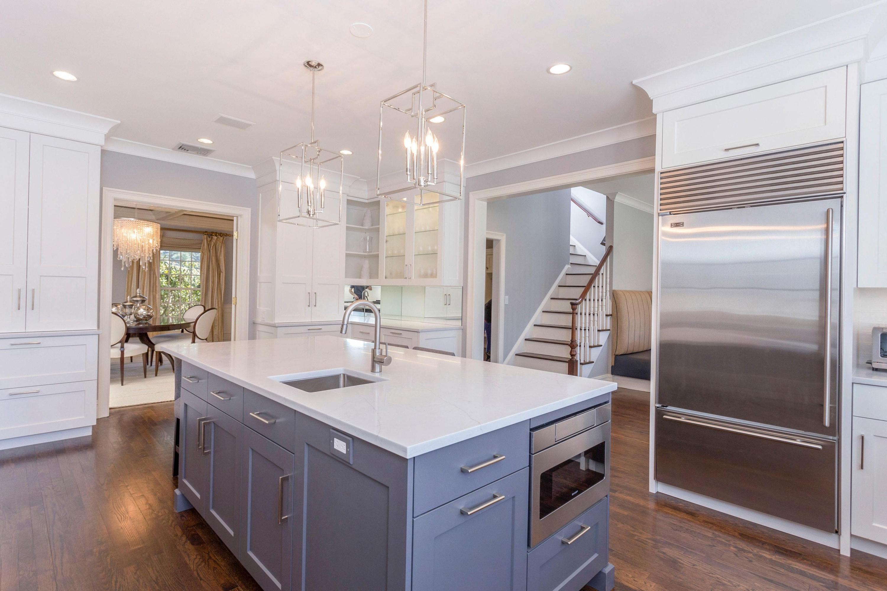 495 Hollow Tree Ridge Road Darien, CT 06820 - Photo 12 of 33 a kitchen with kitchen island a counter top space appliances and a center island