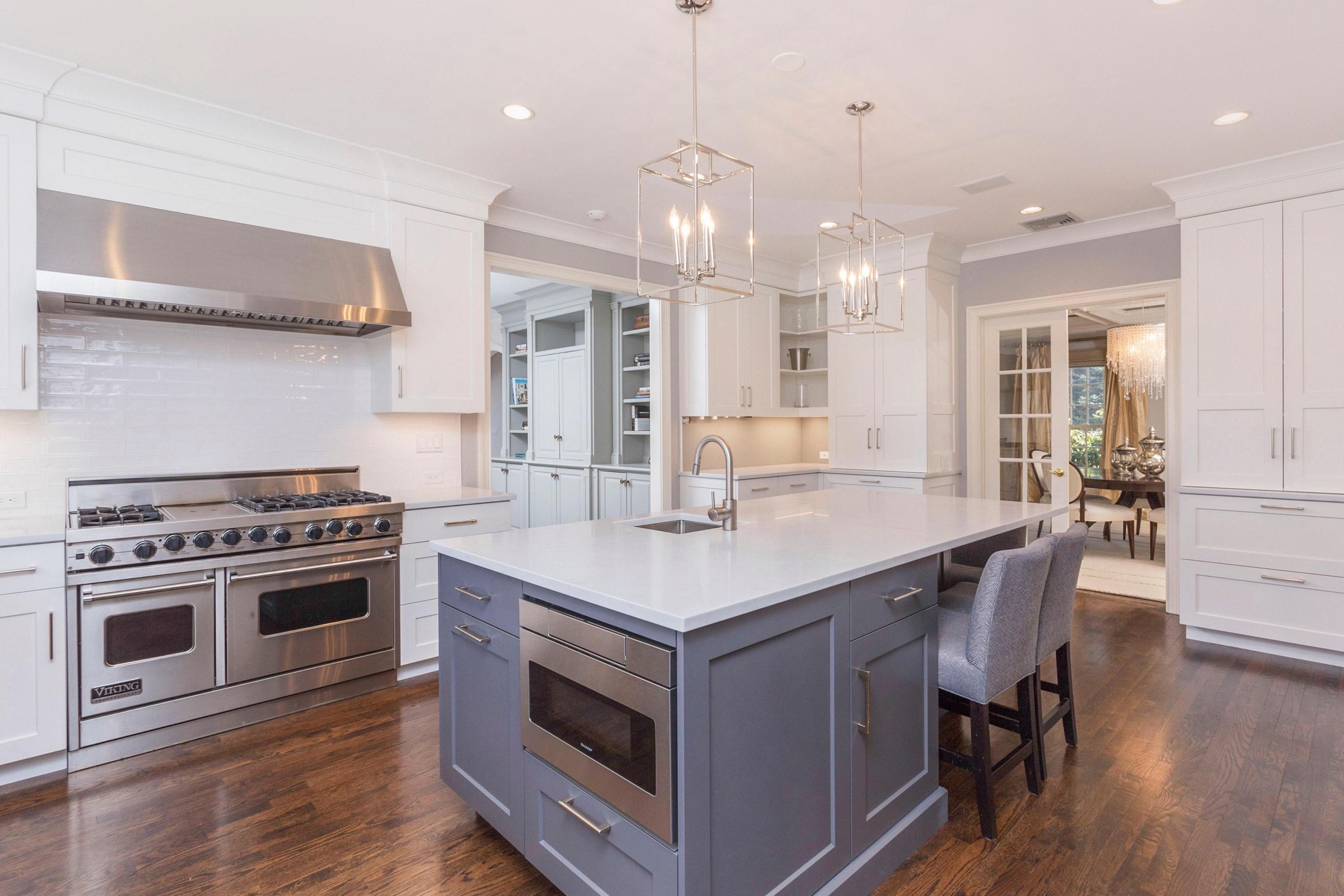 495 Hollow Tree Ridge Road Darien, CT 06820 - Photo 14 of 33 a kitchen with a stove and a wooden floor