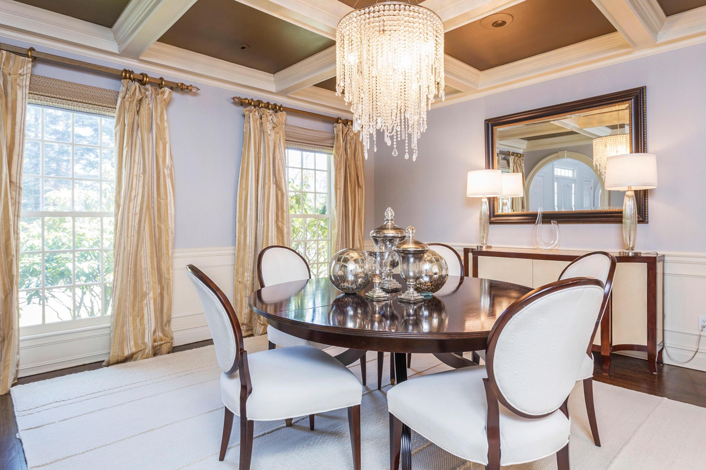 495 Hollow Tree Ridge Road Darien, CT 06820 - Photo 16 of 33 a view of a dining room with furniture and chandelier