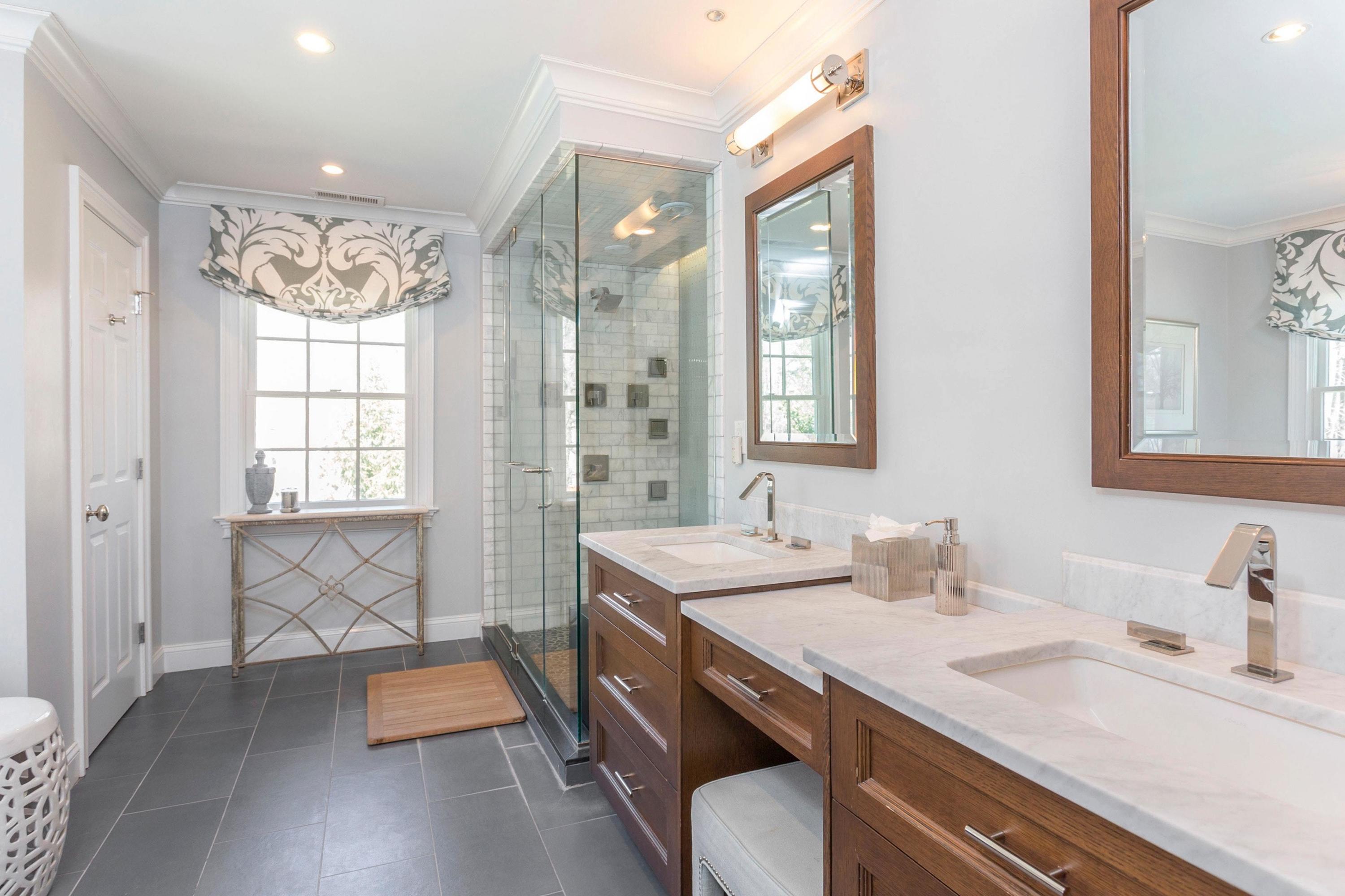 495 Hollow Tree Ridge Road Darien, CT 06820 - Photo 19 of 33 a bathroom with a sink double vanity granite tub and shower
