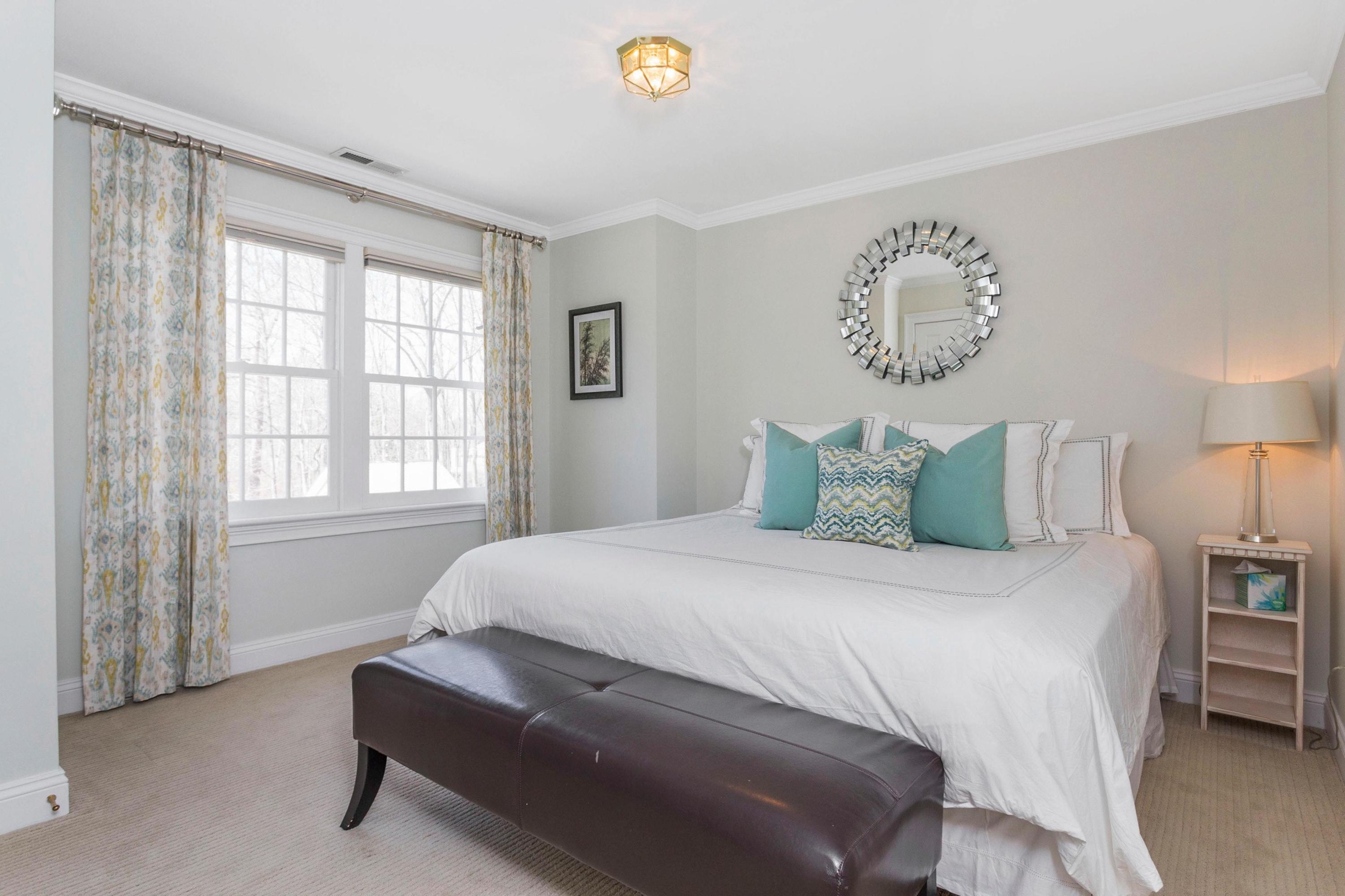 495 Hollow Tree Ridge Road Darien, CT 06820 - Photo 22 of 33 a bedroom with a bed and a window