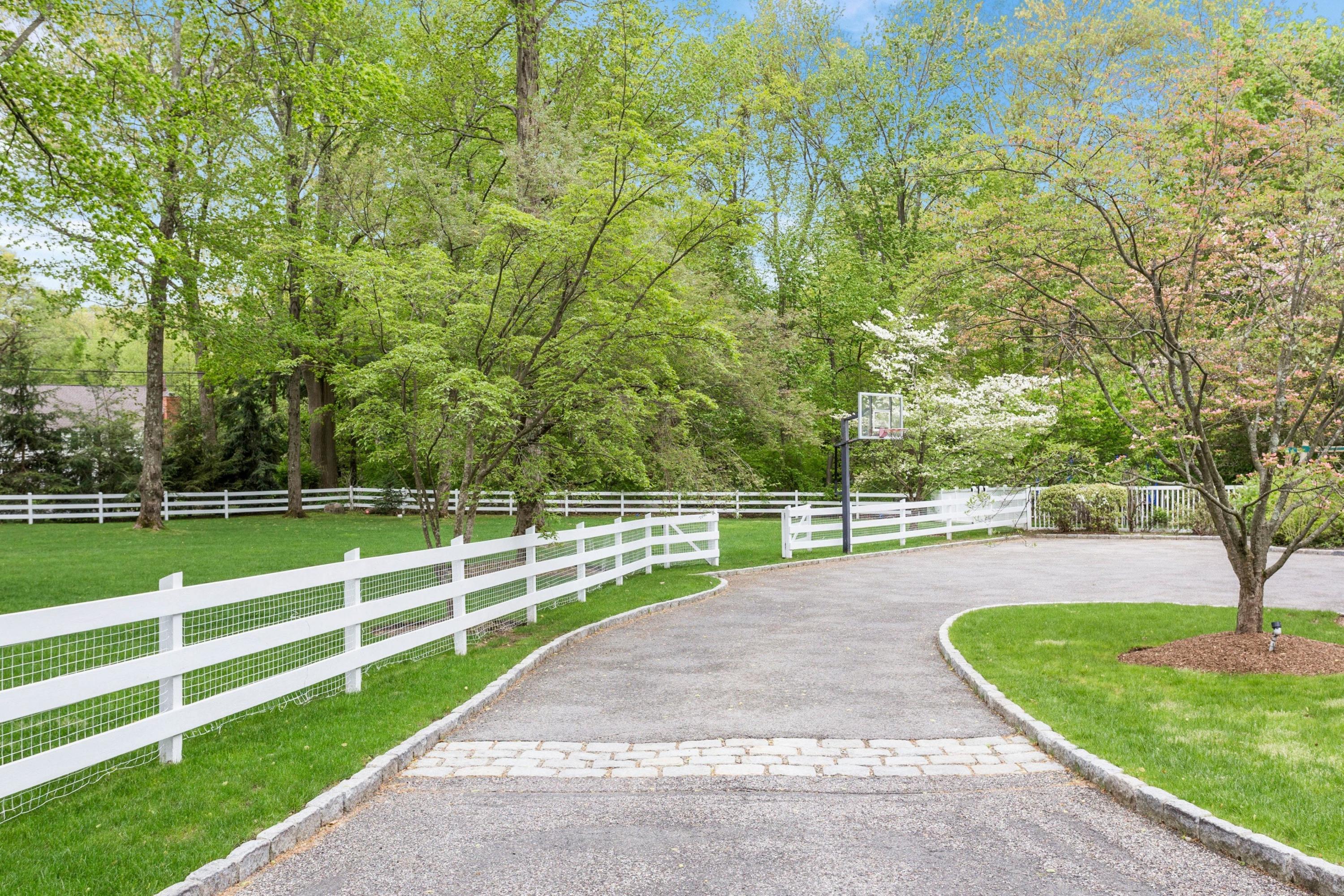 495 Hollow Tree Ridge Road Darien, CT 06820 - Photo 29 of 33 a view of a backyard with wooden fence