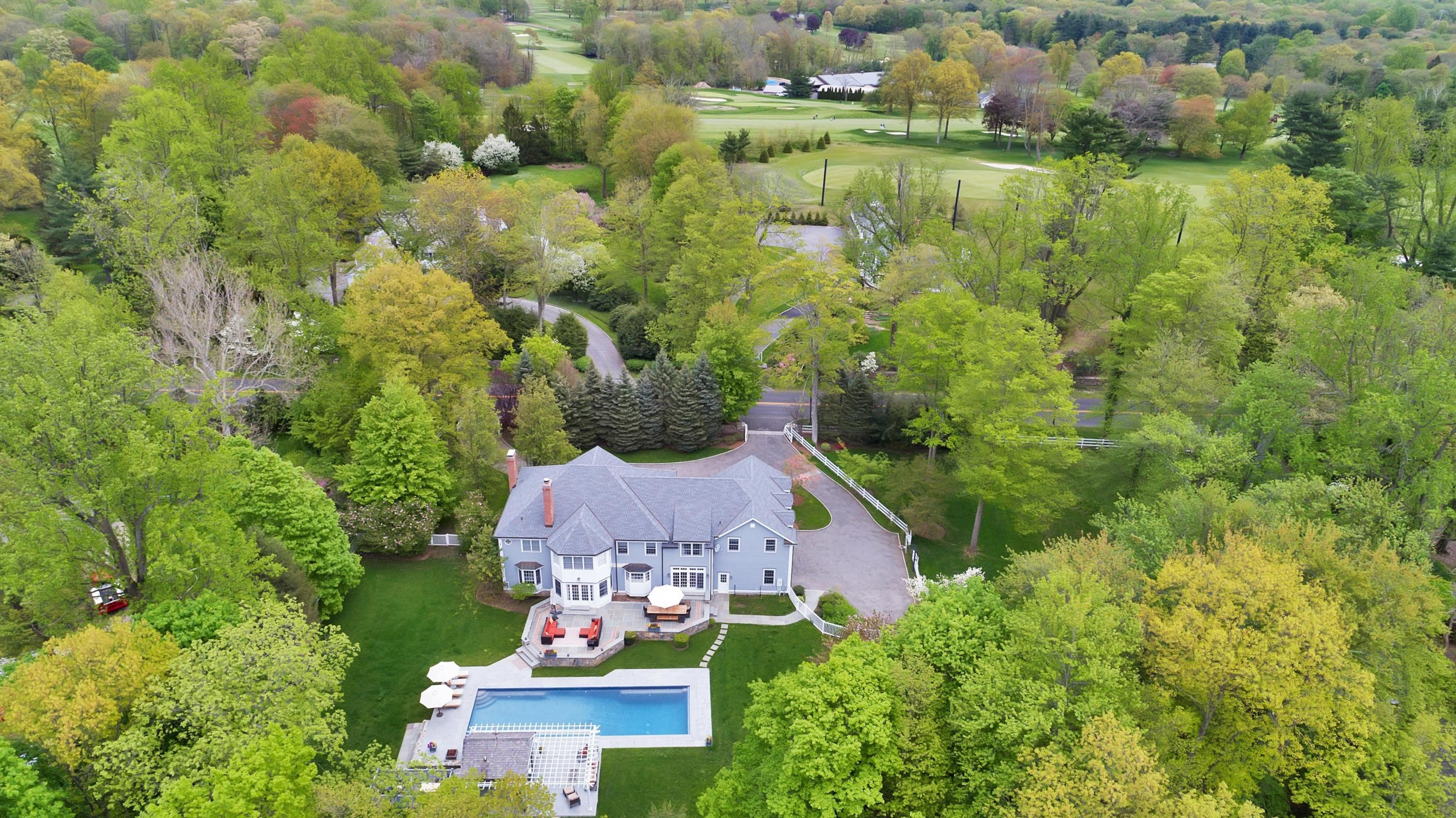 495 Hollow Tree Ridge Road Darien, CT 06820 - Photo 30 of 33 an aerial view of residential house with outdoor space and swimming pool