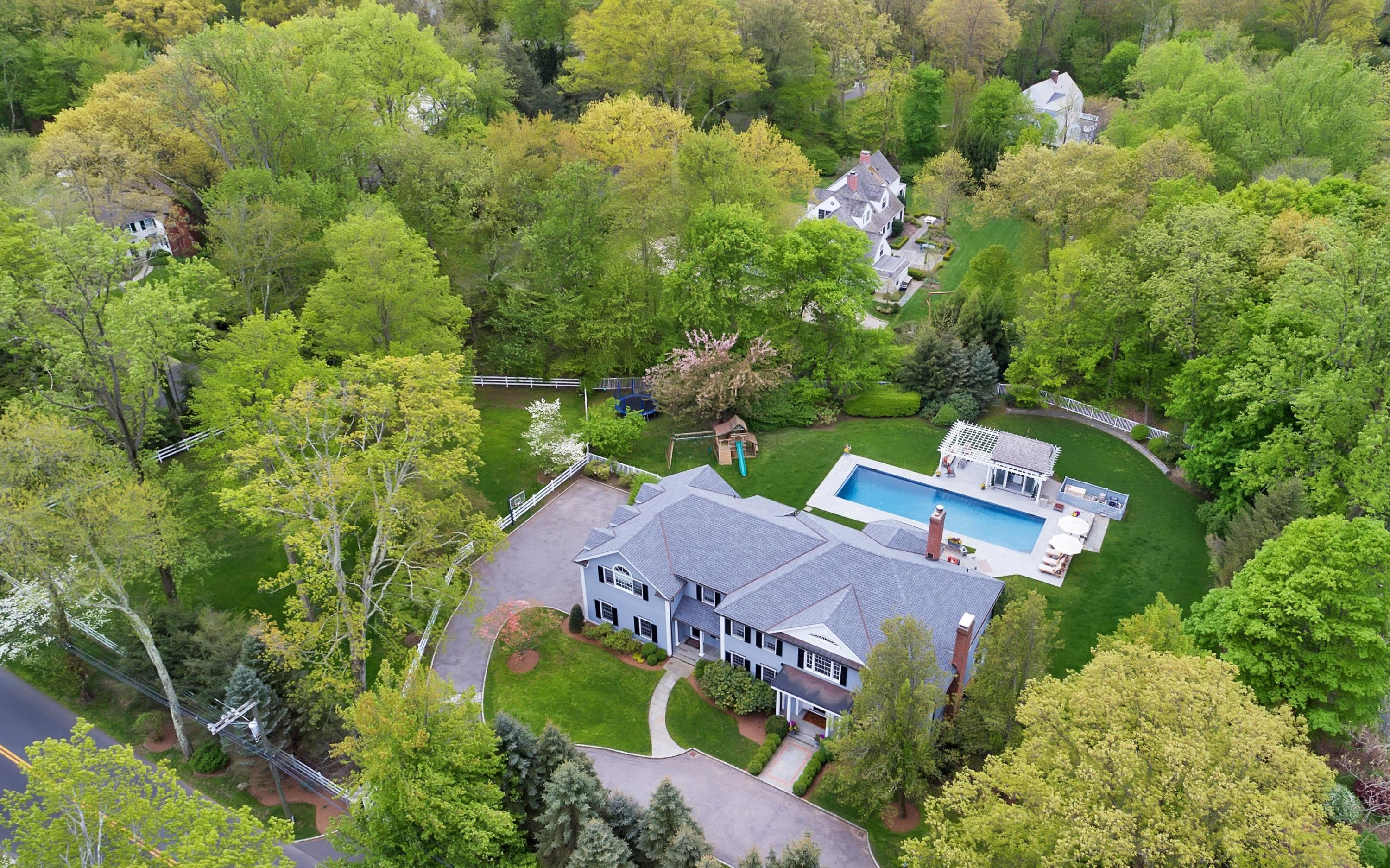 495 Hollow Tree Ridge Road Darien, CT 06820 - Photo 5 of 33 an aerial view of house with yard swimming pool and outdoor seating
