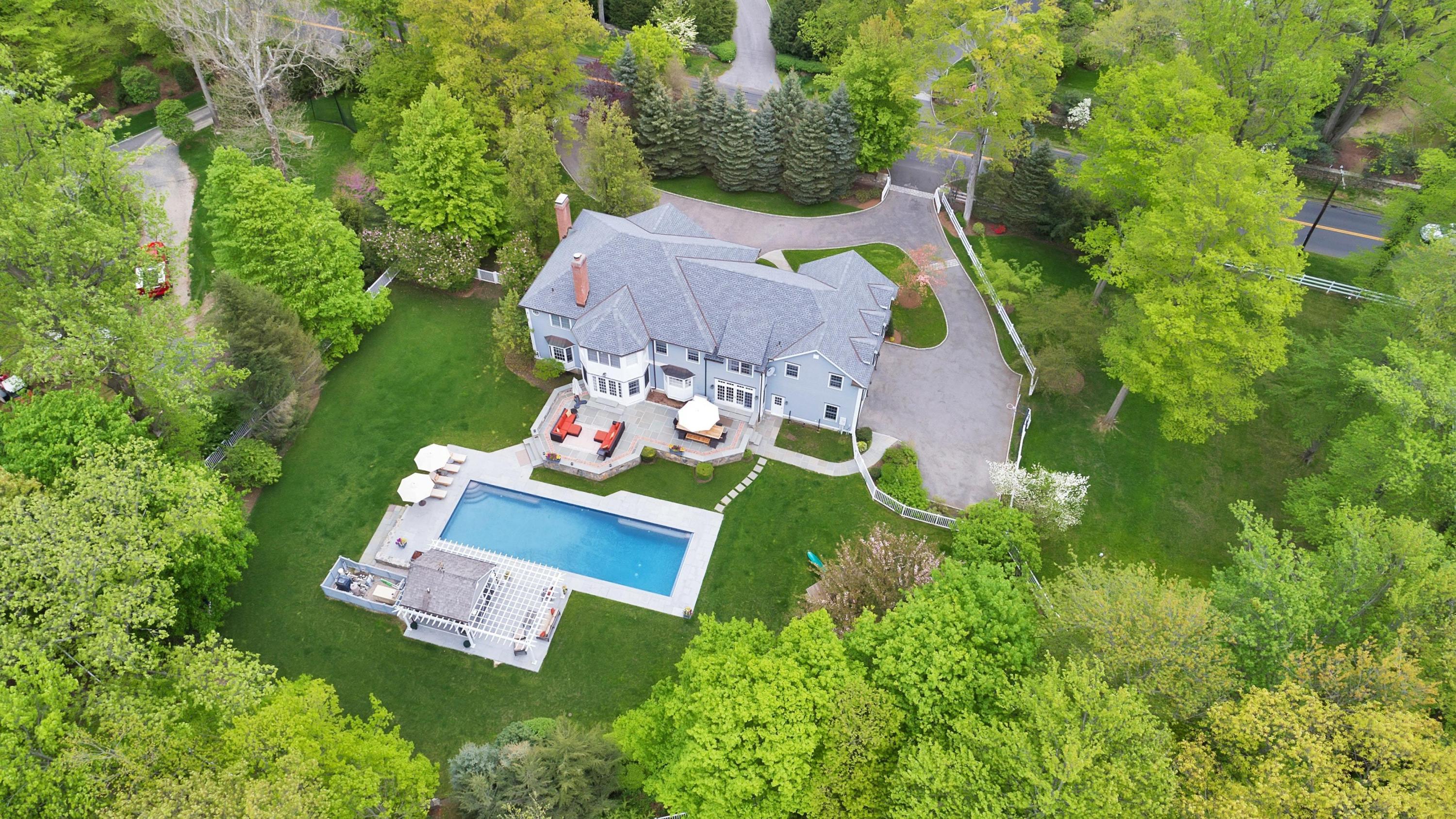 495 Hollow Tree Ridge Road Darien, CT 06820 - Photo 6 of 33 an aerial view of residential house with outdoor space and parking