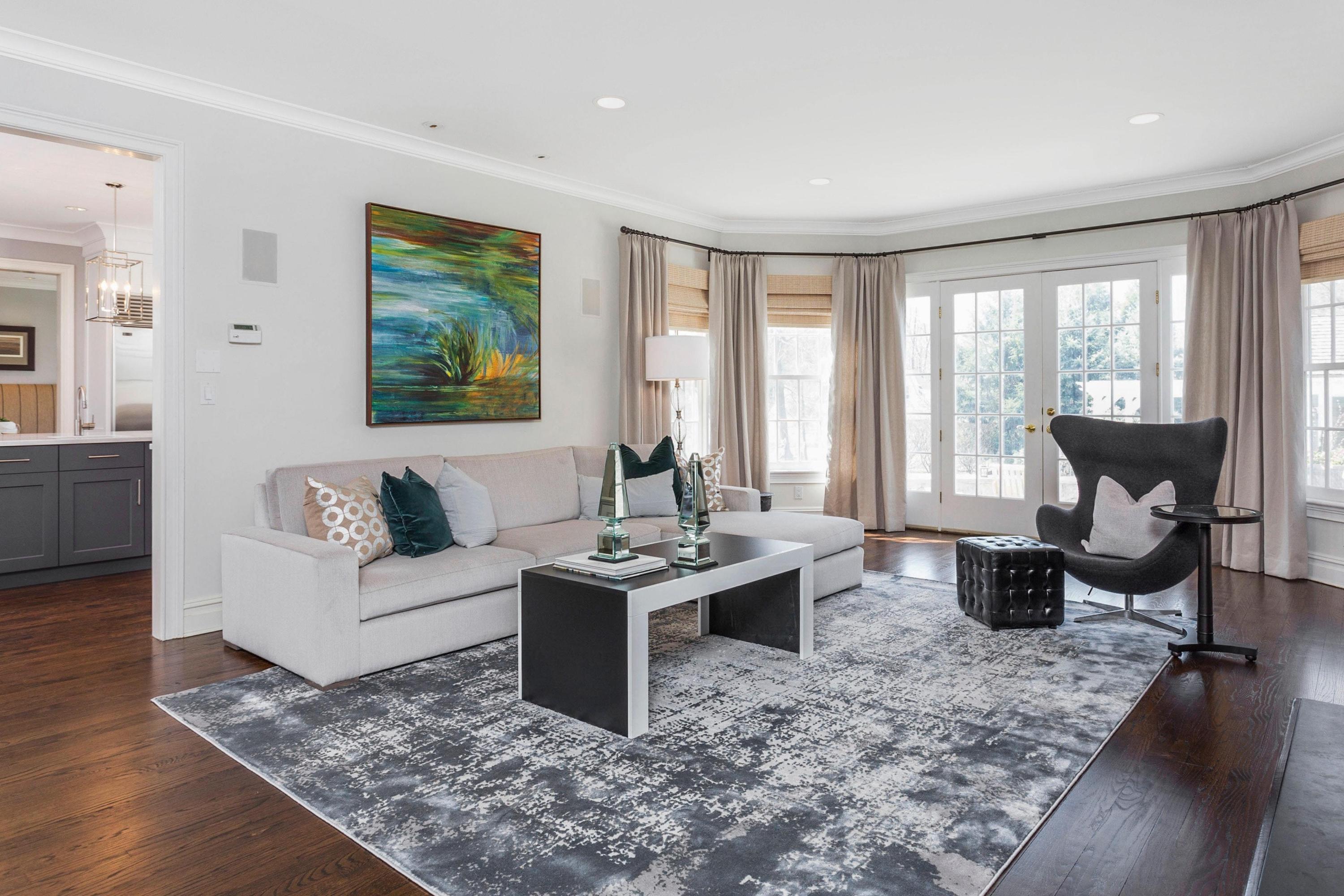 495 Hollow Tree Ridge Road Darien, CT 06820 - Photo 9 of 33 a living room with furniture a rug a large window and a table