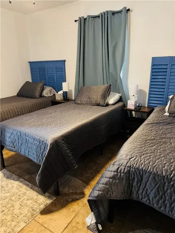 a bedroom with bed and a closet