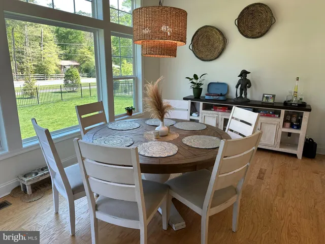 a dining room with furniture window wooden floor