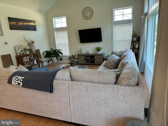 a kitchen with granite countertop a table and chairs in it