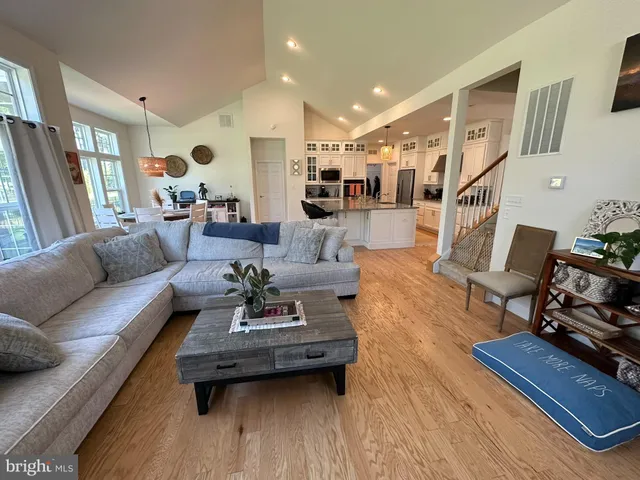 a living room with furniture fireplace and a table