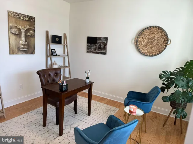 a view of a workspace with furniture