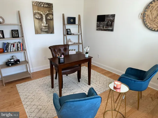 a view of a workspace with furniture