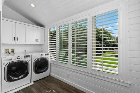 a view of a kitchen with washing machine and dryer