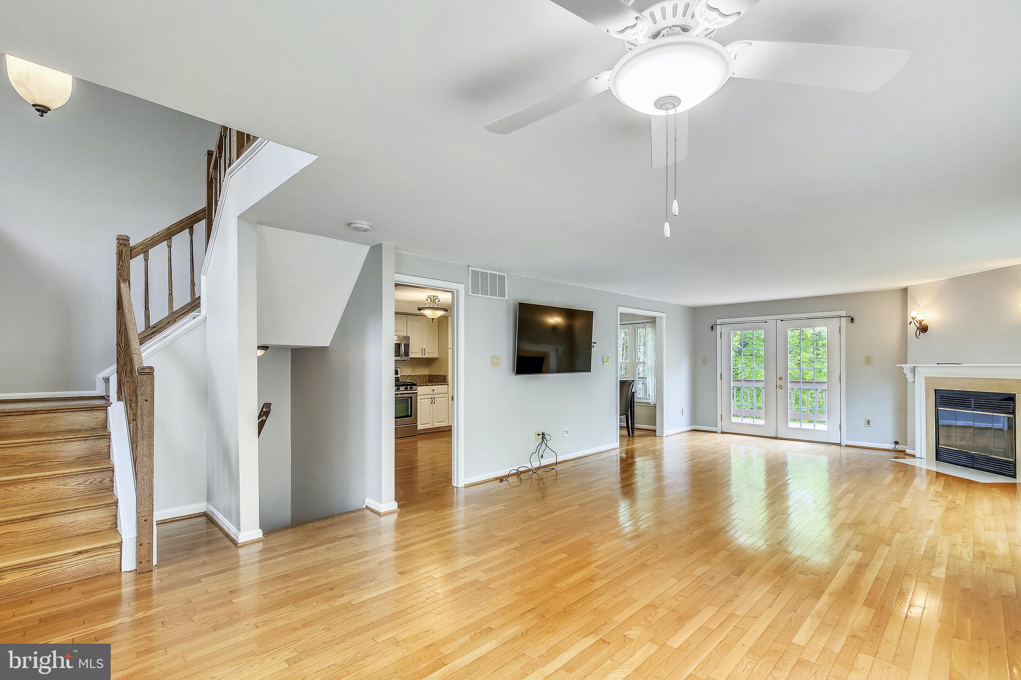 1530 Deer Point Way Reston, VA 20194 - Photo 14 of 42 a view of an empty room with window and wooden floor