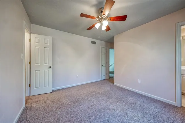 a white toilet sitting next to a bathroom sink