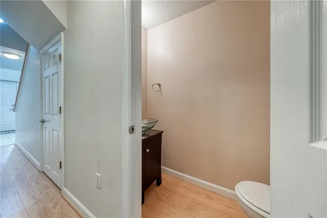 an empty room with closet and natural light