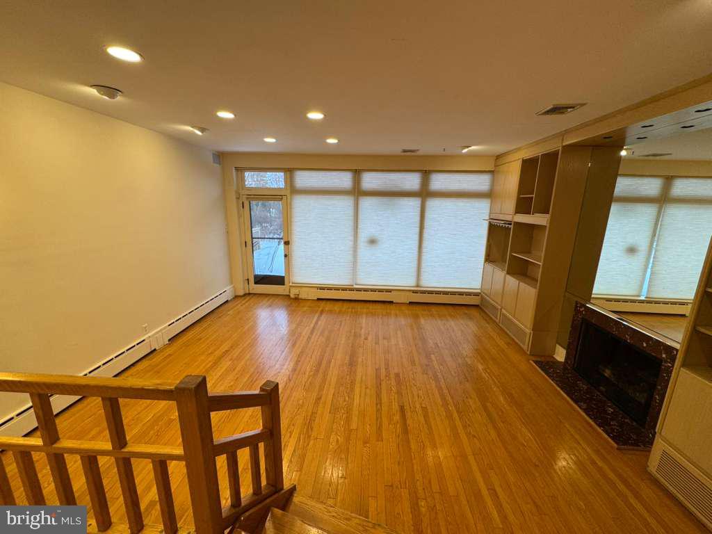 8233 Fairview Road Elkins Park, PA 19027 - Photo 8 of 38 Great Room with Built Ins and Hardwood Floors
